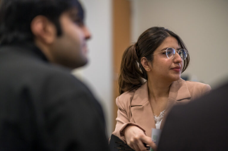 EMDD students Zainab Aamir and Matt Lowe compete in the 2023 Three-Minute Thesis competition at Ball State University's Emmens Auditorium, Thursday, February 23, 2023. Aamir won both the competition and the People's Choice award for her project on privacy in virtual reality, and Lowe won third place for his project comparing the transmedia stopry structures resulting from the January 6 Commission Report.
