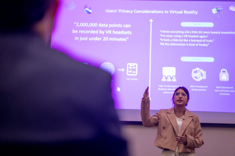 EMDD students Zainab Aamir and Matt Lowe compete in the 2023 Three-Minute Thesis competition at Ball State University's Emmens Auditorium, Thursday, February 23, 2023. Aamir won both the competition and the People's Choice award for her project on privacy in virtual reality, and Lowe won third place for his project comparing the transmedia stopry structures resulting from the January 6 Commission Report.